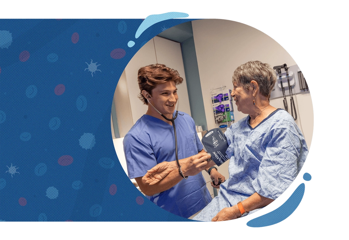 Young tech taking elder's blood pressure